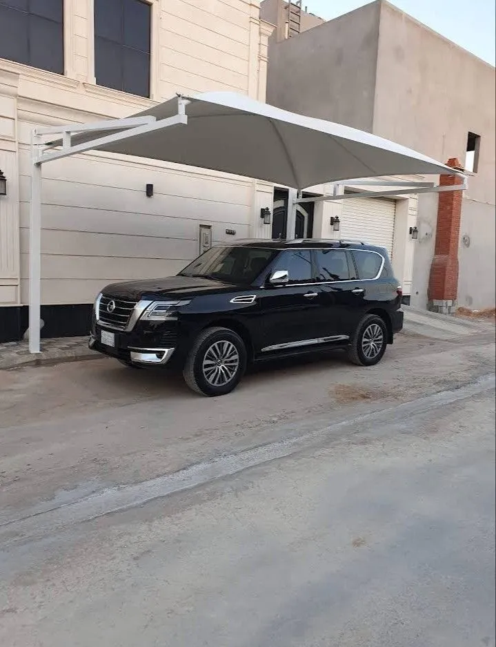 تركيب مظلات سيارات قماشية في حي الملقا بالرياض