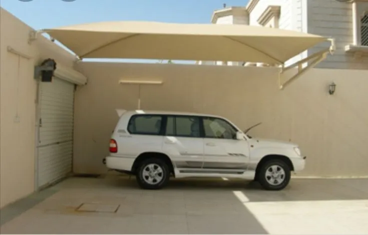 تركيب مظلات سيارات قماشية في حي الملقا بالرياض