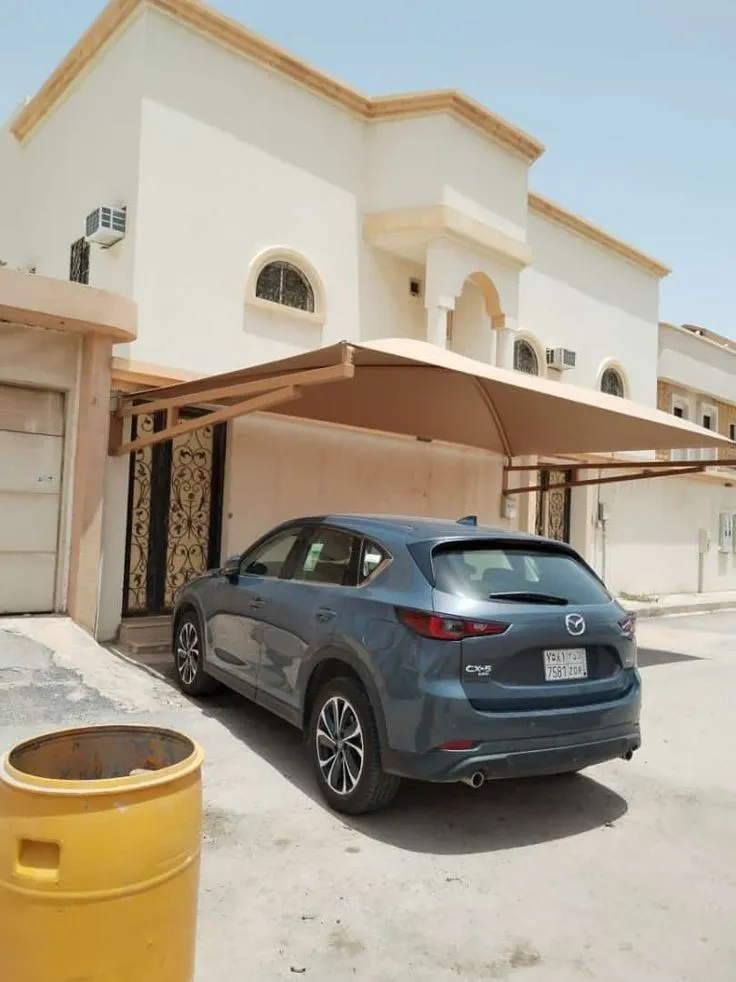 تركيب مظلات سيارات قماشية في حي الملقا بالرياض
