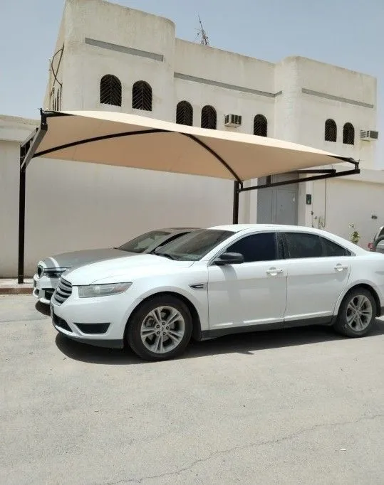 تركيب مظلات سيارات قماشية في حي الملقا بالرياض